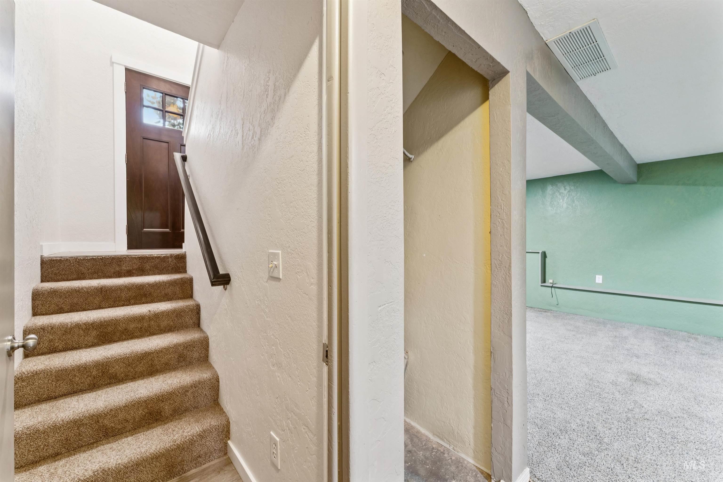 4811 North Leather Way Boise, ID 83713 - Photo 21 of 32 Staircase with a textured wall and carpet floors