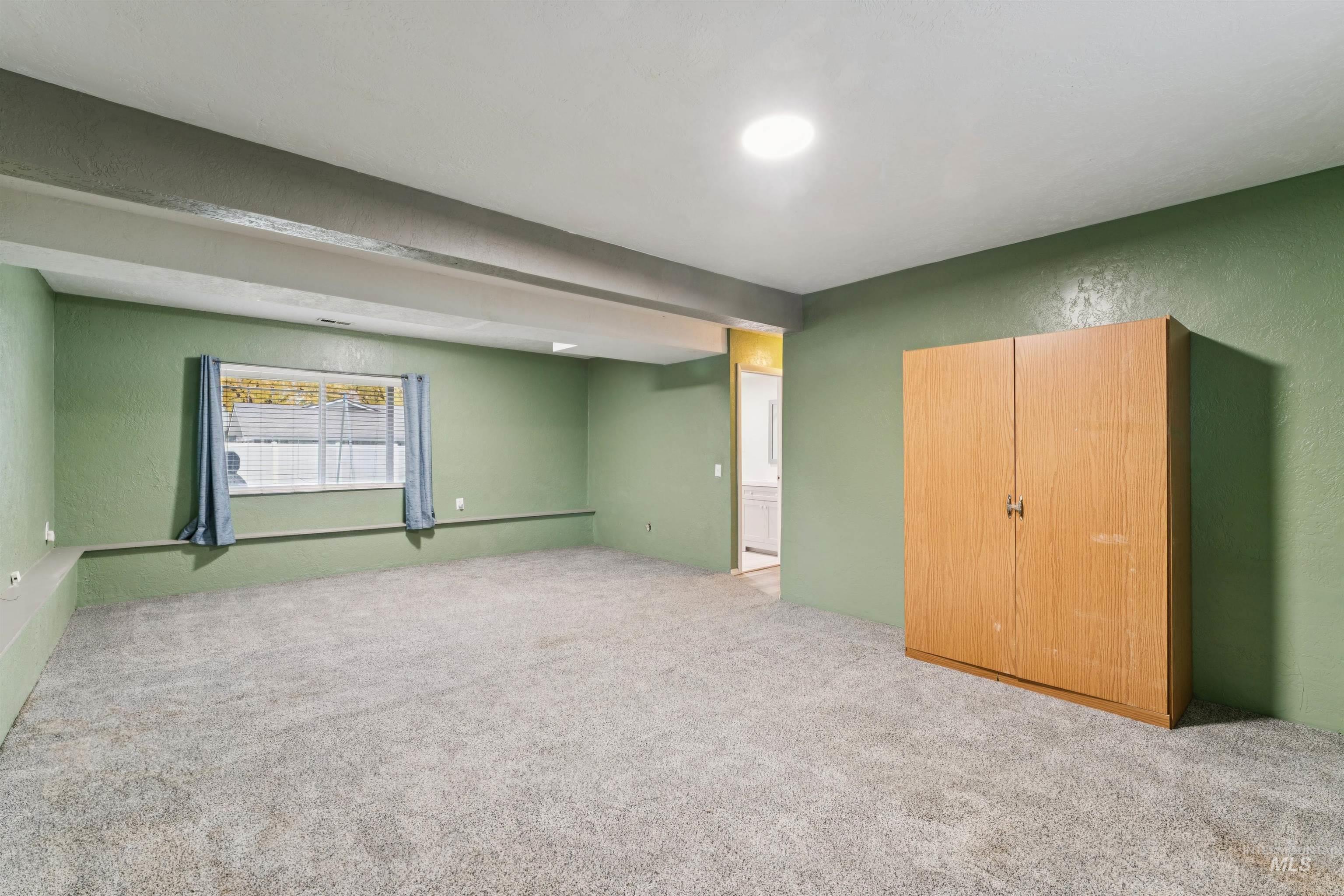4811 North Leather Way Boise, ID 83713 - Photo 23 of 32 Unfurnished bedroom with a textured wall and carpet