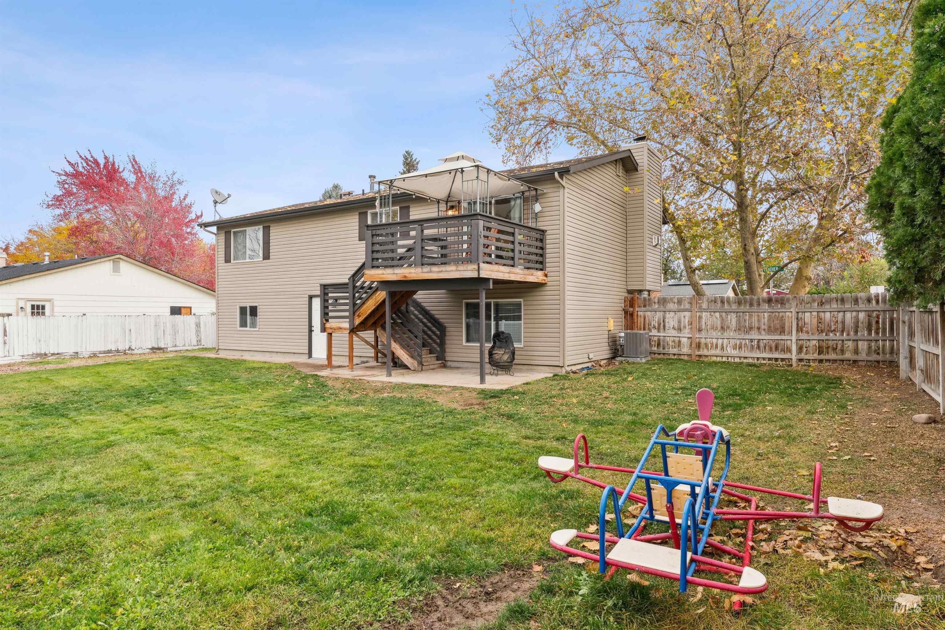 4811 North Leather Way Boise, ID 83713 - Photo 30 of 32 Rear view of property with a patio, a fenced backyard, stairway, and a wooden deck