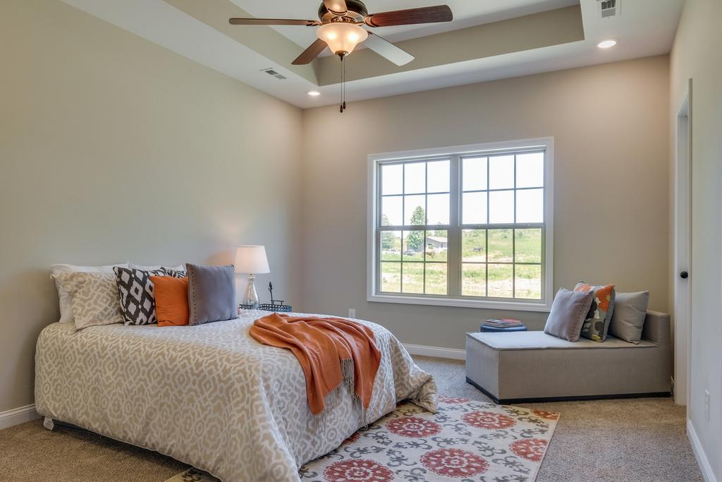 419 Kaiser Road Dickson, TN 37055 - Photo 13 of 27 a bedroom with a bed and a window