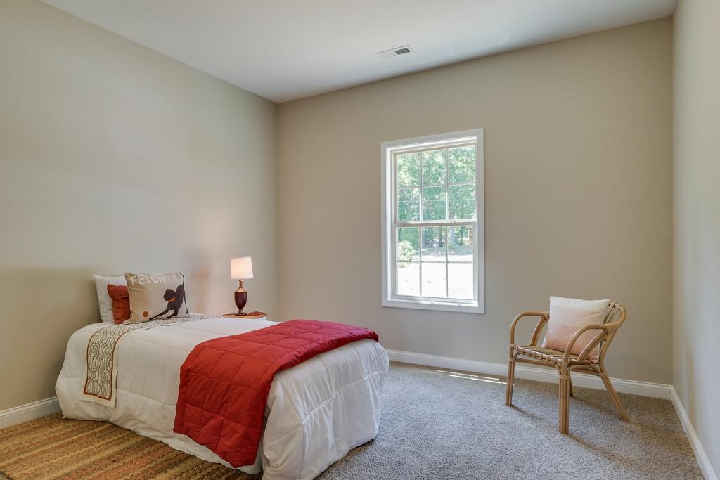 419 Kaiser Road Dickson, TN 37055 - Photo 18 of 27 a bedroom with a bed chair and window
