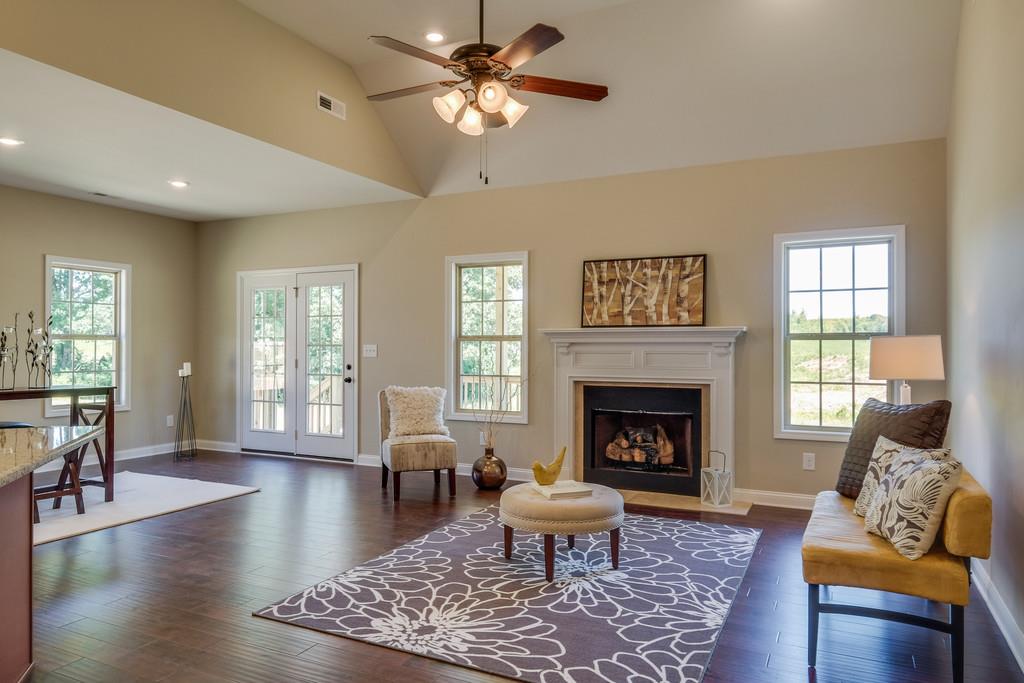 419 Kaiser Road Dickson, TN 37055 - Photo 2 of 27 a living room with furniture and a fireplace