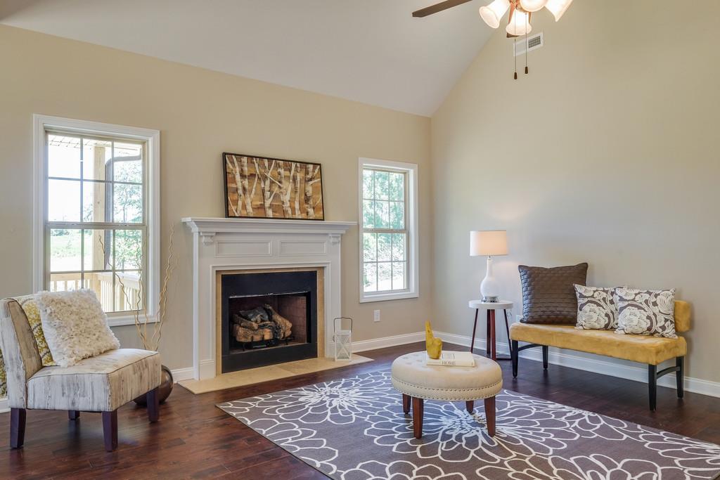 419 Kaiser Road Dickson, TN 37055 - Photo 8 of 27 a living room with a couch a window and a fireplace
