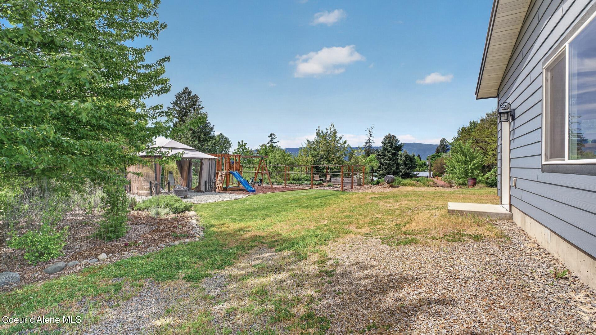 6616 Comanche Street Bonners Ferry, ID 83805 - Photo 49 of 59 051_Backyard_Mountains