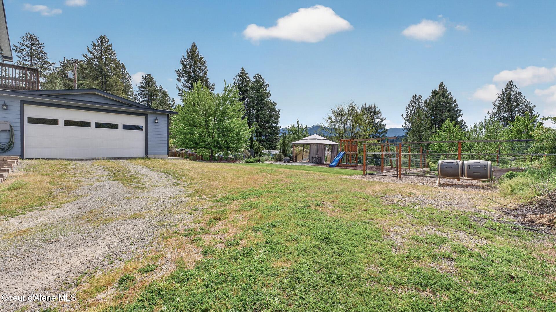 6616 Comanche Street Bonners Ferry, ID 83805 - Photo 54 of 59 056_Backyard_Overview