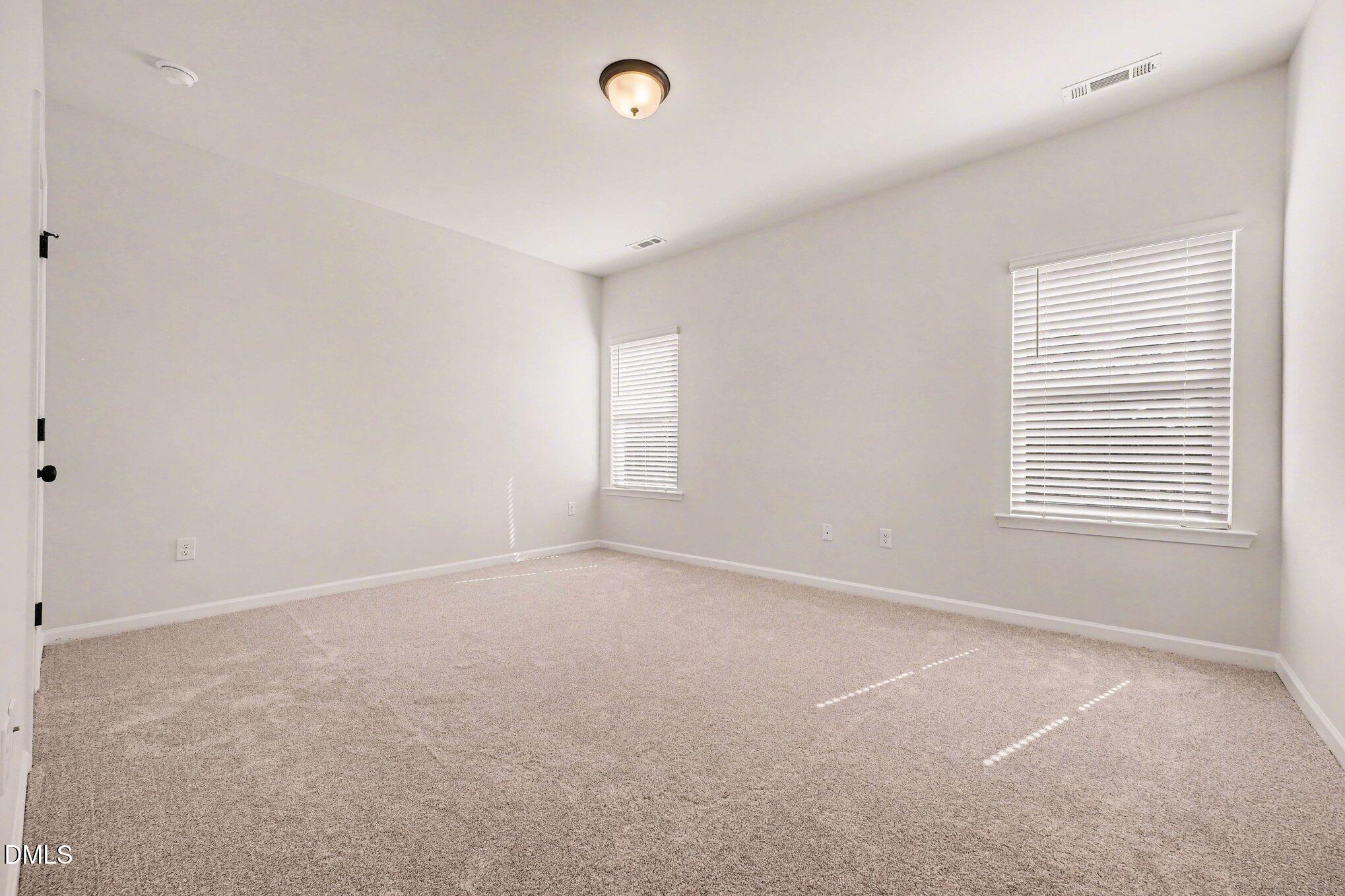 726 Orch Vista Circle Raleigh, NC 27606 - Photo 9 of 28 a view of an empty room with a window