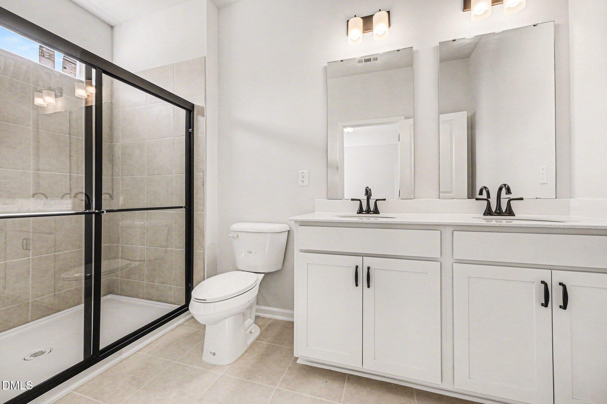 726 Orch Vista Circle Raleigh, NC 27606 - Photo 10 of 28 a bathroom with a sink toilet and shower