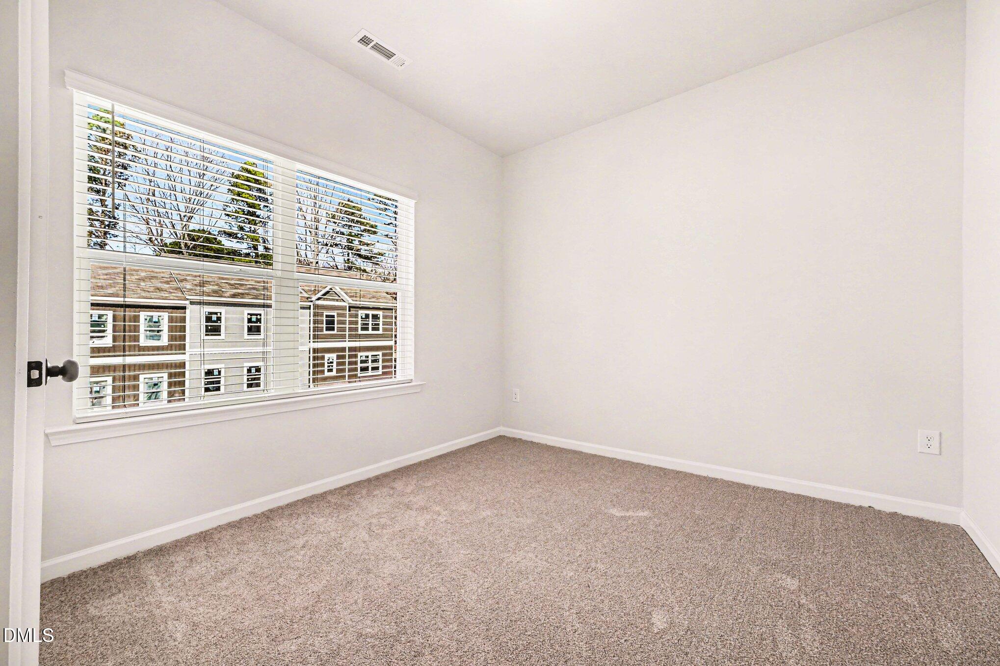 726 Orch Vista Circle Raleigh, NC 27606 - Photo 11 of 28 a view of an empty room with a window