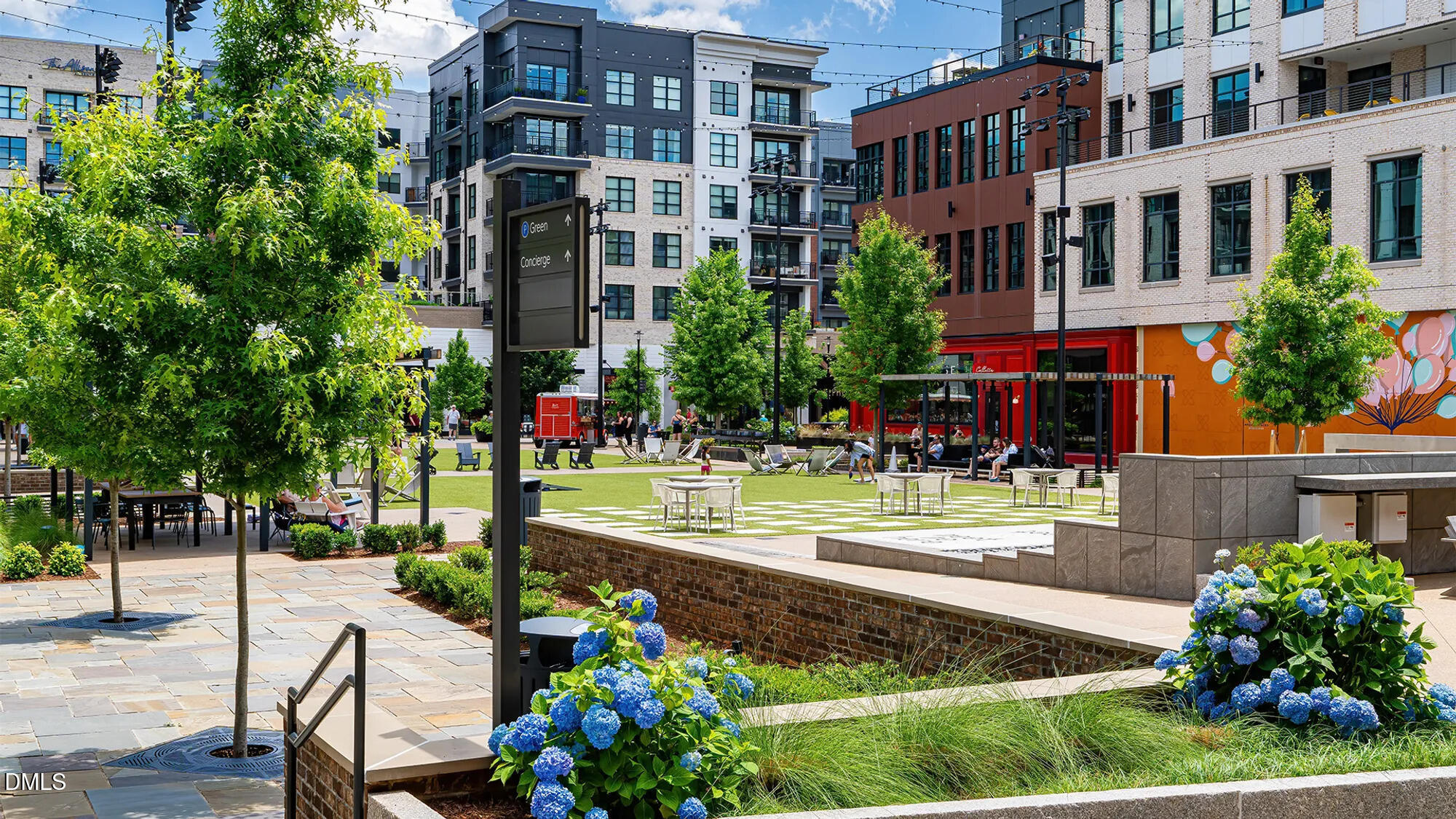726 Orch Vista Circle Raleigh, NC 27606 - Photo 25 of 28 a front view of a building with a garden and plants