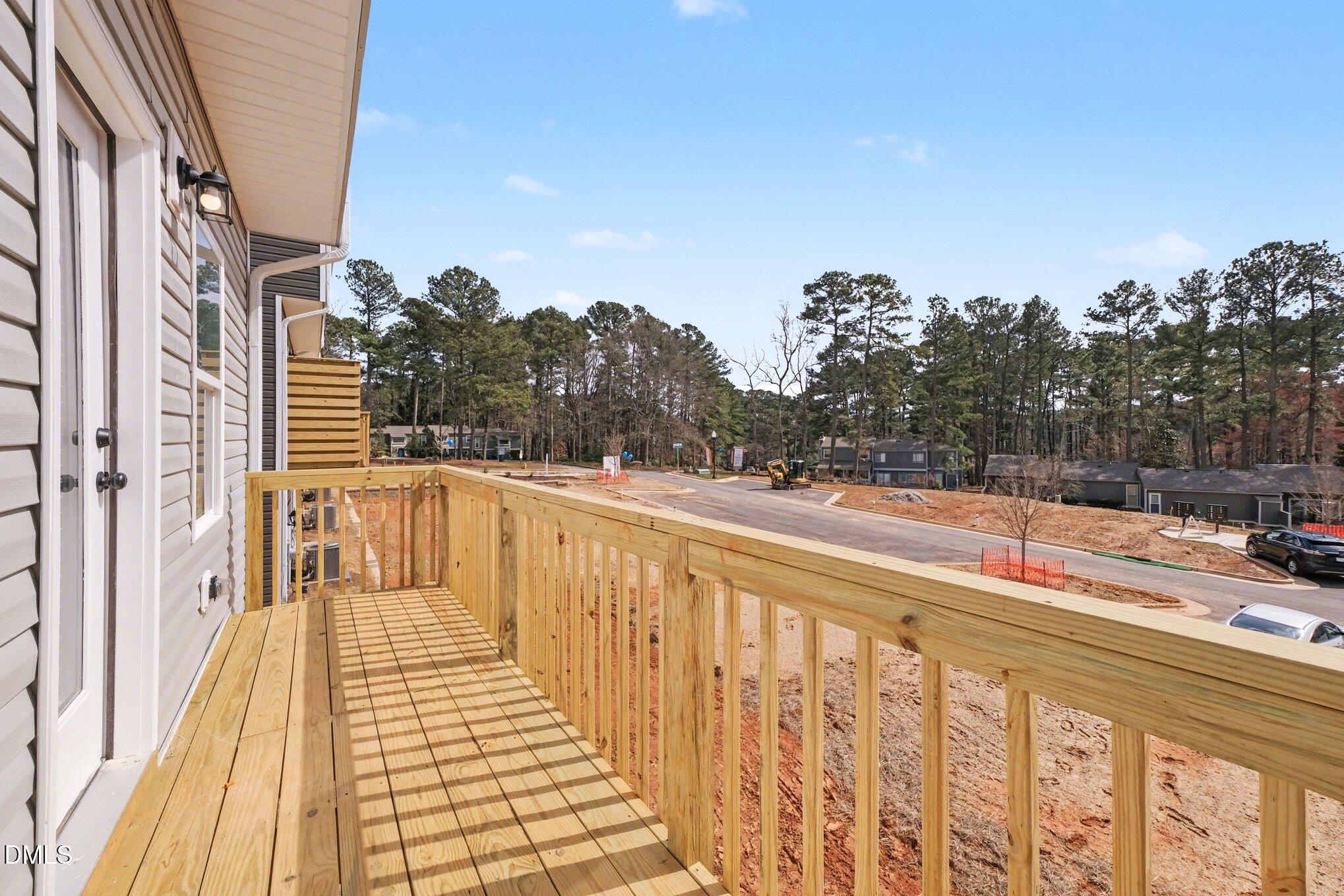 726 Orch Vista Circle Raleigh, NC 27606 - Photo 7 of 28 a view of balcony with wooden floor and city view