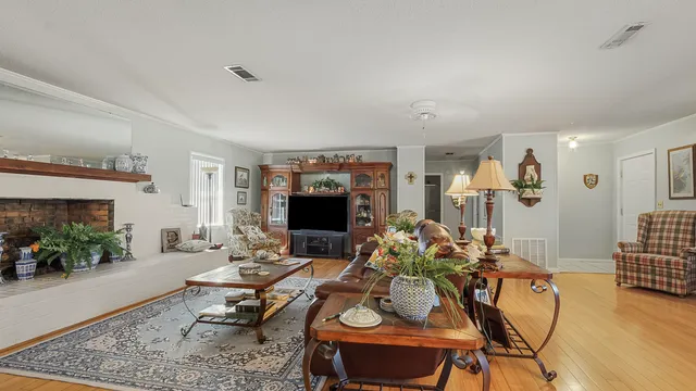 a bedroom with furniture and a flat screen tv