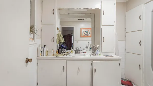 a bedroom with a bed and a cabinets