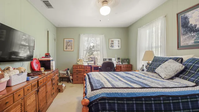 a bathroom with a sink vanity mirror and toilet