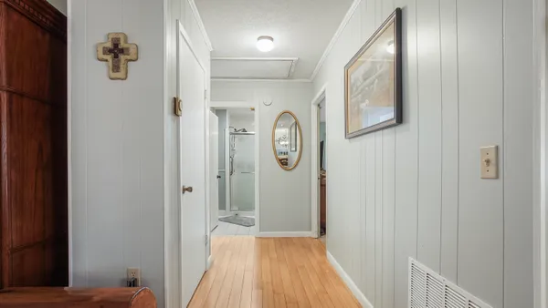 a view of a kitchen from the hallway