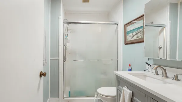 a bedroom with a bed and a cabinets