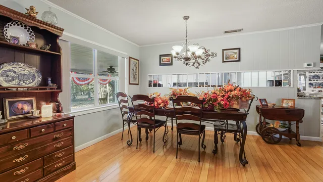 a living room with fireplace furniture and a flat screen tv