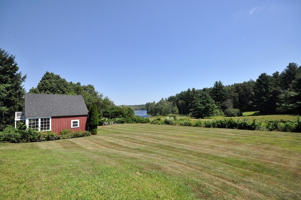1228 Lowell Road Concord, MA 01742 - Photo 21 of 27 a view of a house with a yard