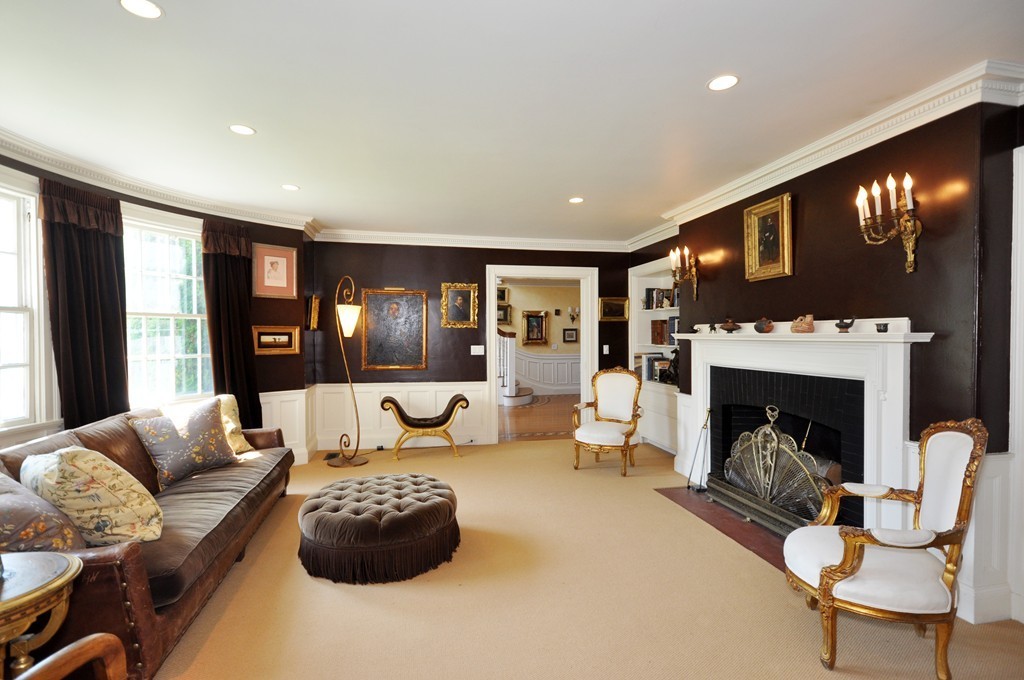1228 Lowell Road Concord, MA 01742 - Photo 8 of 27 a living room with furniture and a fireplace