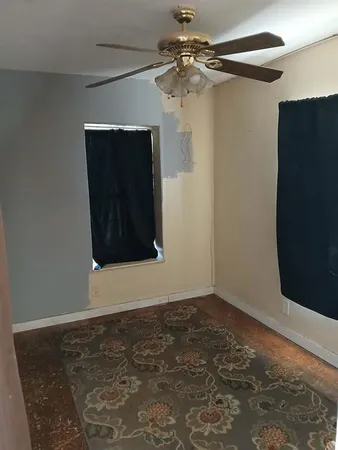 a bathroom with a toilet and a shower curtain