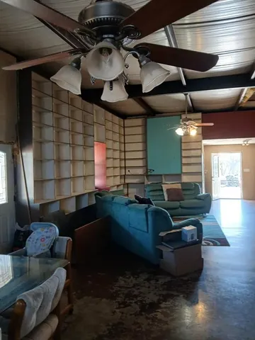 a living room with furniture and a rug