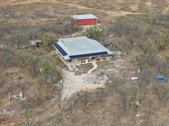 a view of a small pool in the backyard