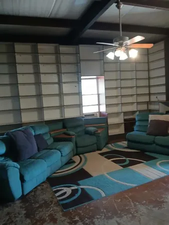 a living room with furniture and a rug