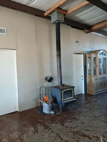 a kitchen with stainless steel appliances kitchen island granite countertop a stove and a refrigerator