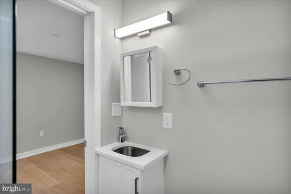 a bathroom with a sink and vanity