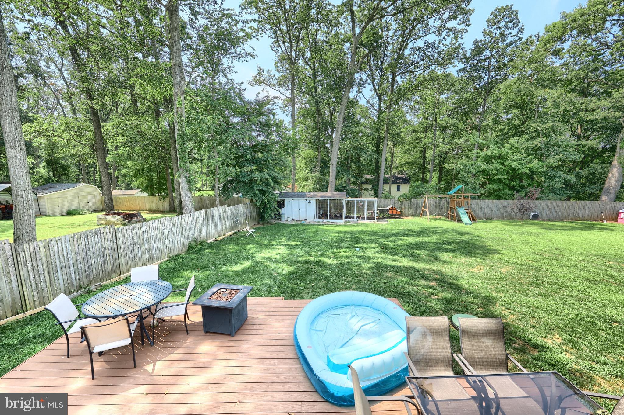60 Massa Drive Windsor, PA 17366 - Photo 15 of 40 a view of a chair and table in back yard of the house