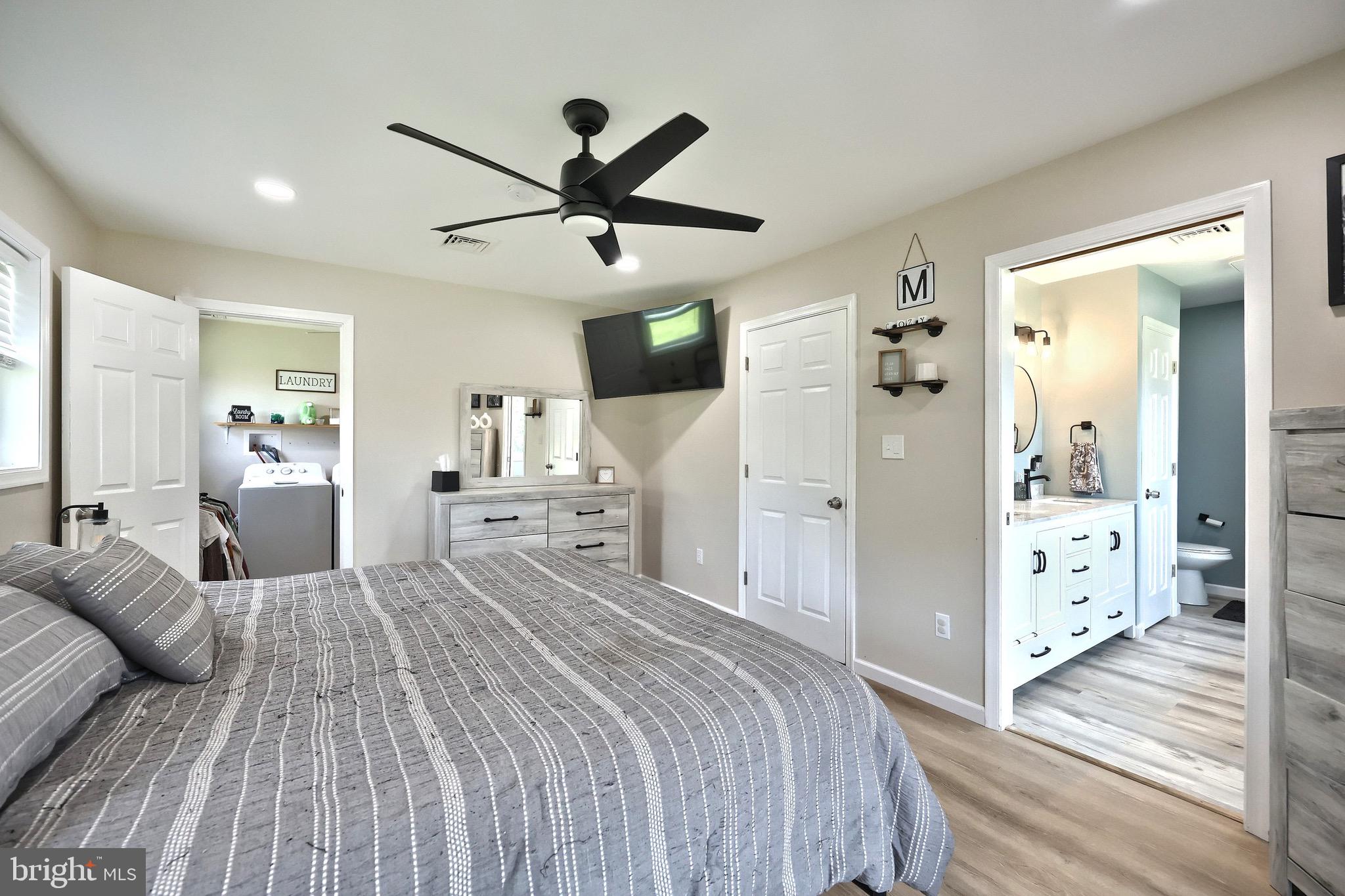 60 Massa Drive Windsor, PA 17366 - Photo 30 of 40 a spacious bedroom with a bed and a walk in closet