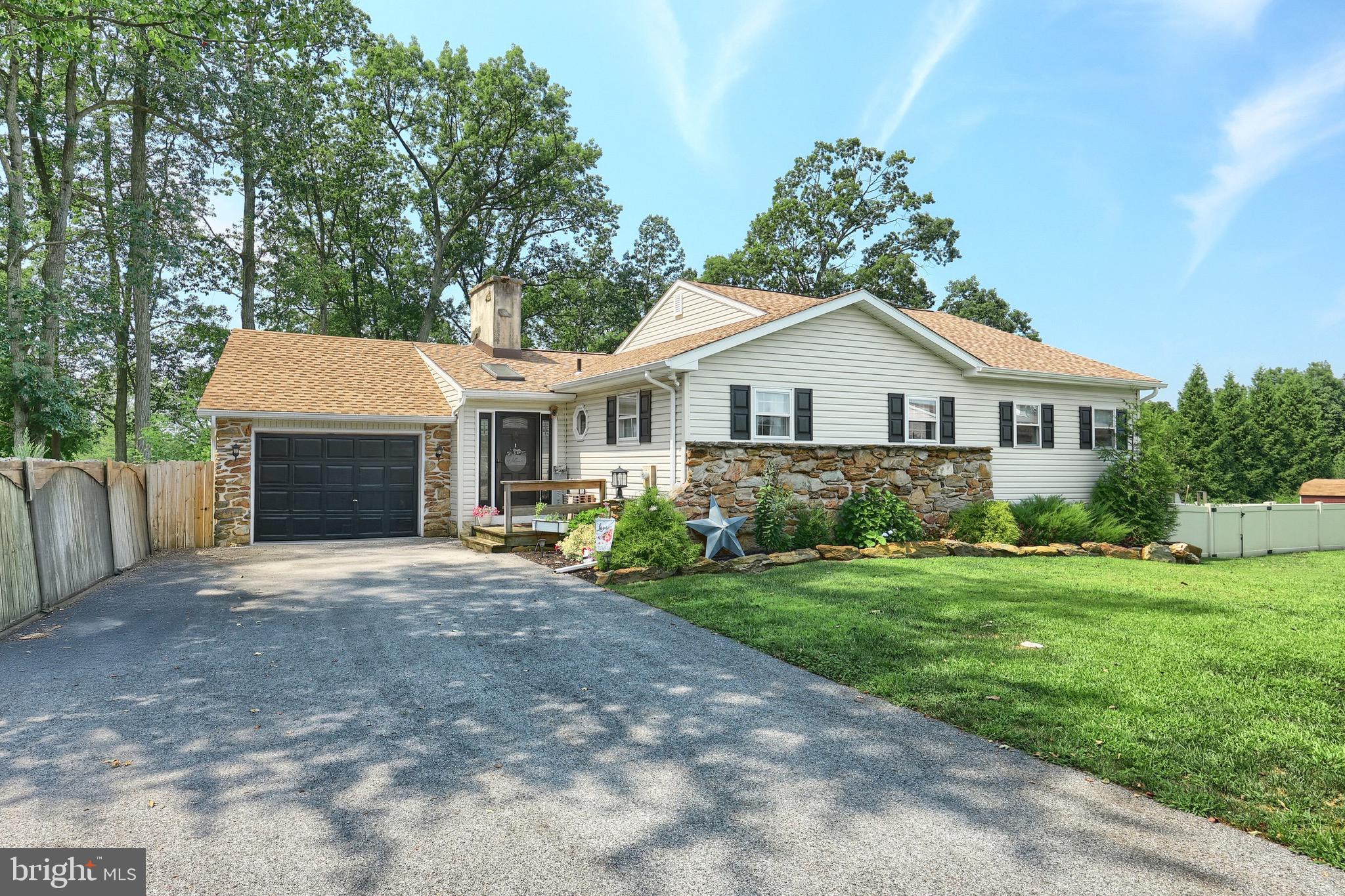 60 Massa Drive Windsor, PA 17366 - Photo 3 of 40 a front view of a house with a yard and trees