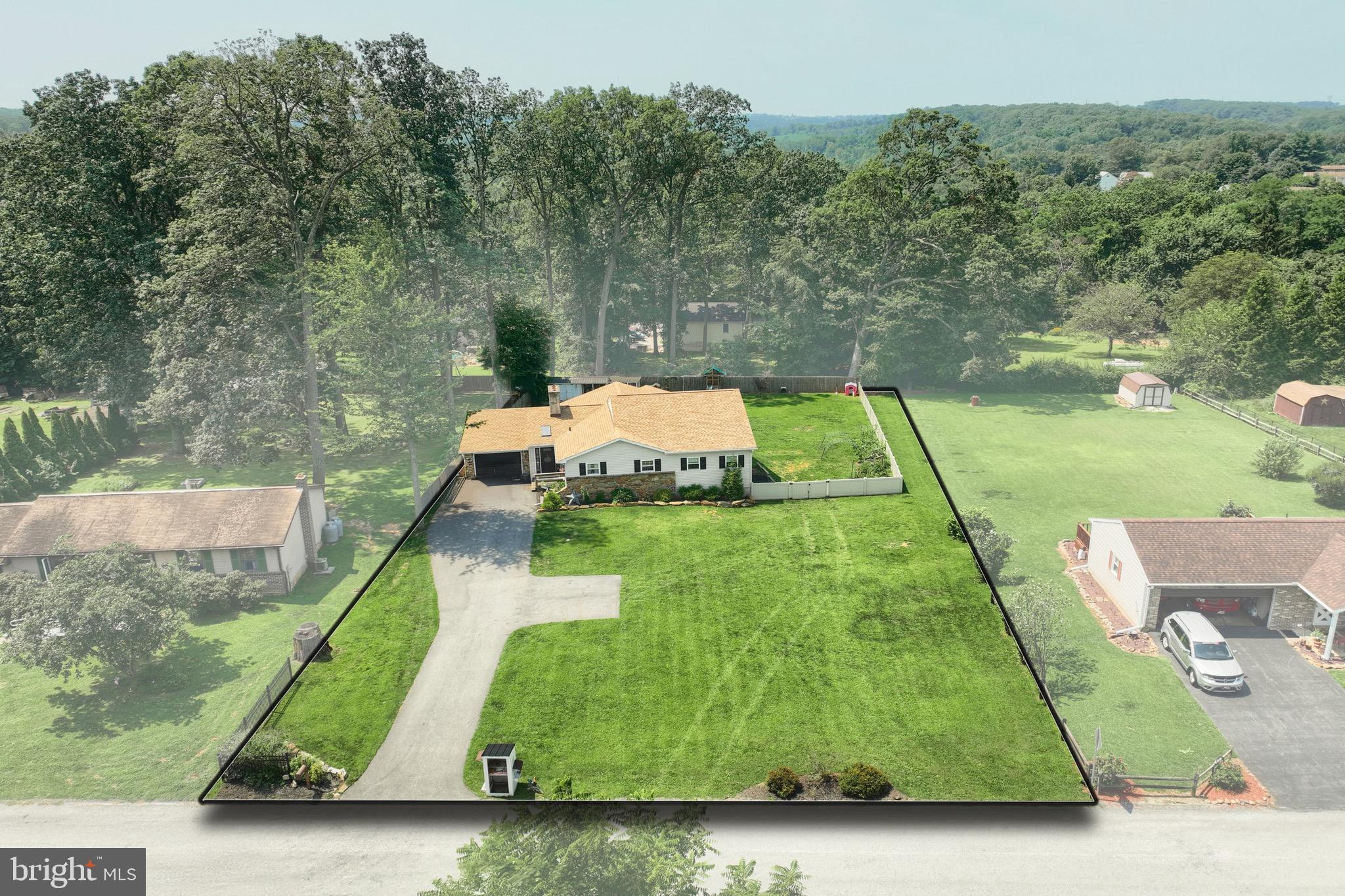 60 Massa Drive Windsor, PA 17366 - Photo 5 of 40 a green field with lots of trees