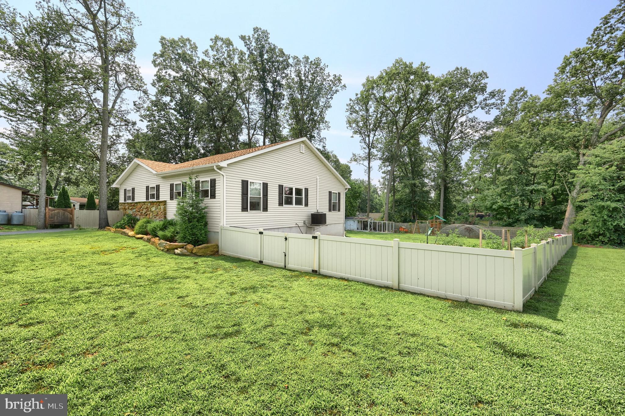 60 Massa Drive Windsor, PA 17366 - Photo 8 of 40 a white house that has a tree in front of it