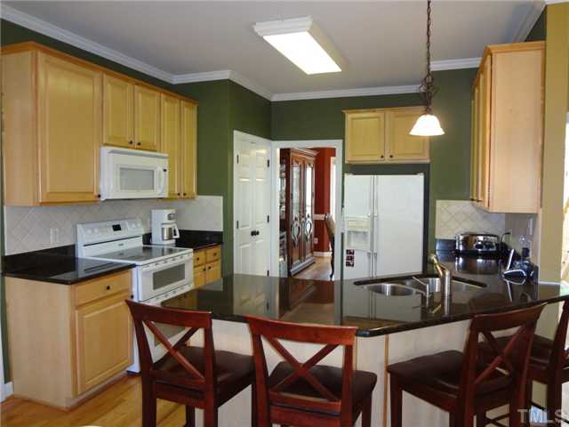 2701 Dray Court Raleigh, NC 27613 - Photo 7 of 25 42" Raised Panel Cabinets with Granite Countertops