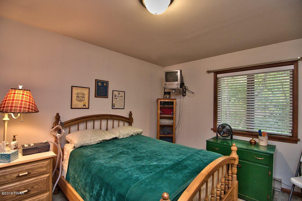 1 East Lake Road Moscow, PA 18444 - Photo 30 of 88 a bedroom with furniture and a window