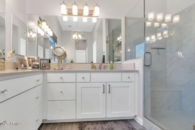 a bedroom with a bed and a potted plant