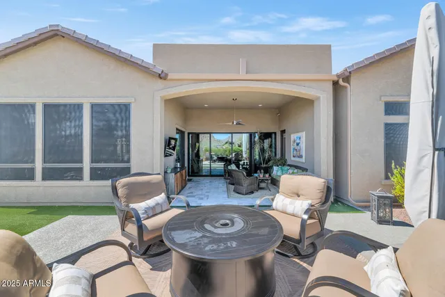 a view of a balcony with furniture