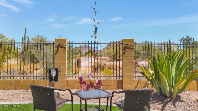 a view of a backyard with sitting area
