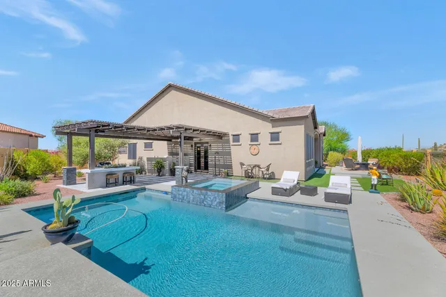 a view of a terrace with couches and pool