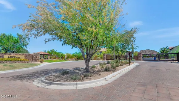 an aerial view of residential houses with outdoor space and ocean view