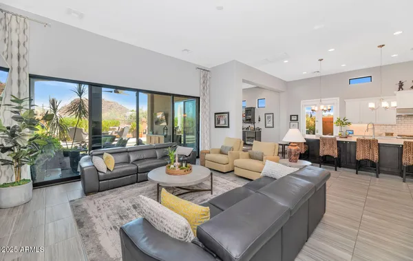 a large kitchen with kitchen island a white counter space a sink cabinets and appliances