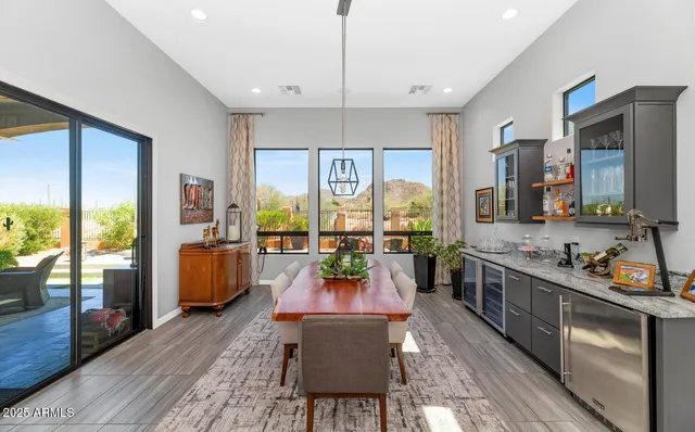 a room with furniture water view and large windows