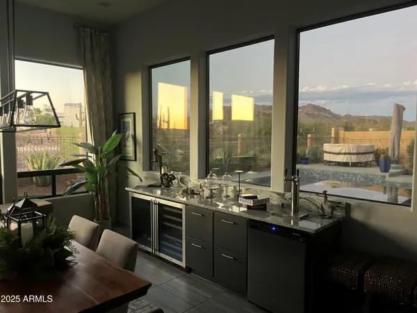 a living room with furniture a rug and a chandelier