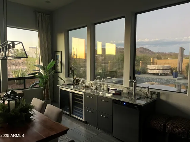 a living room with furniture a rug and a chandelier