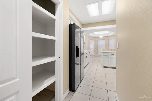 a bathroom with a glass shower door and a bathtub