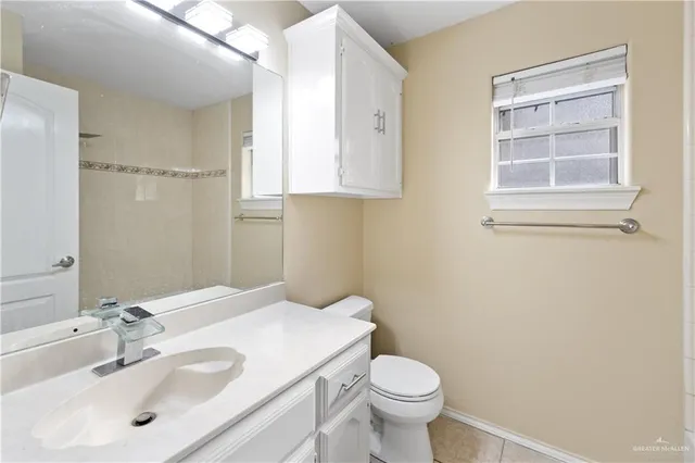 a bathroom with a sink toilet and vanity