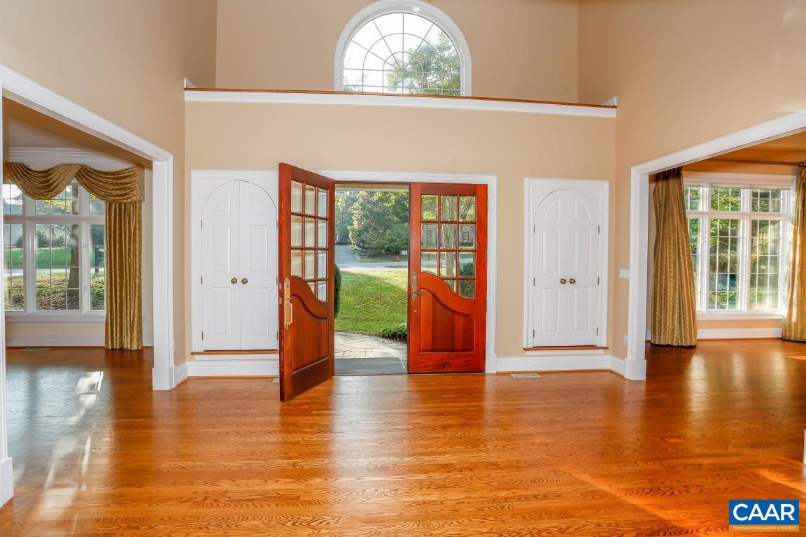 3092 Darby Road Keswick, VA 22947 - Photo 3 of 50 a view of an entryway with wooden floor and a floor to ceiling window