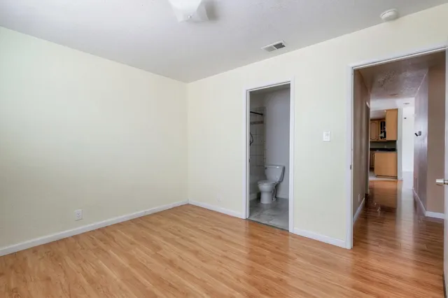 a view of a house with backyard and a garage