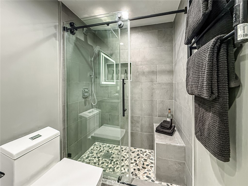 2235 Burnside Street Simi Valley, CA 93065 - Photo 41 of 71 a bathroom with a shower toilet and sink