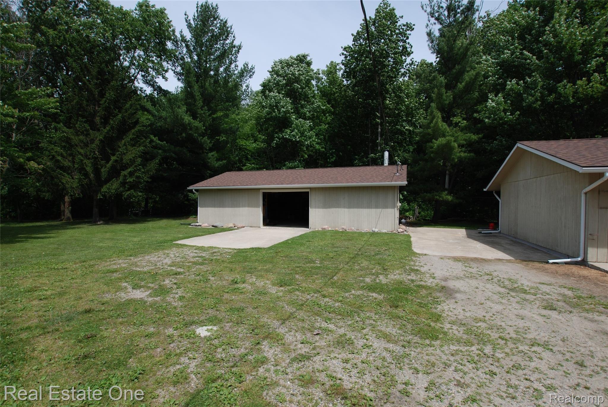6185 Bricker Road Avoca, MI 48006 - Photo 8 of 32 Large 40' x 24' storage barn with concrete floor for all your toys and equipment